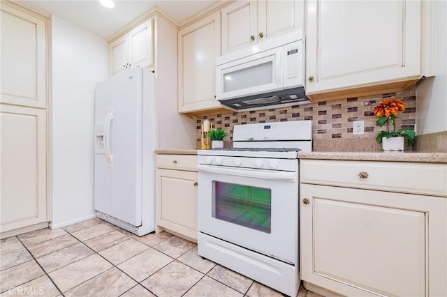 kitchen featuring light tile patterned floors, backsplash, and white appliances