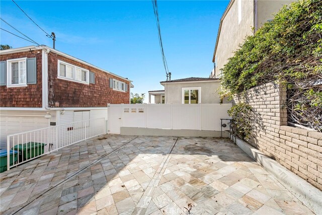 1051 Gaviota Dr, Laguna Beach, CA 92651 - view of patio featuring an attached garage