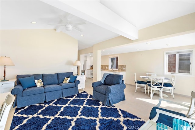 living room with ceiling fan and lofted ceiling with beams