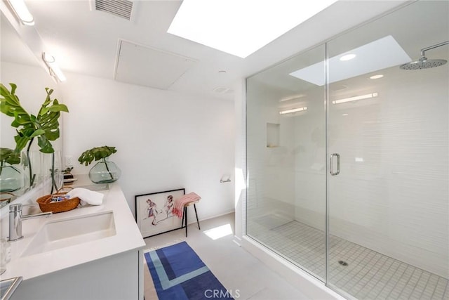 bathroom with vanity and an enclosed shower