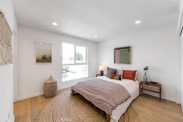 bedroom with light wood-type flooring