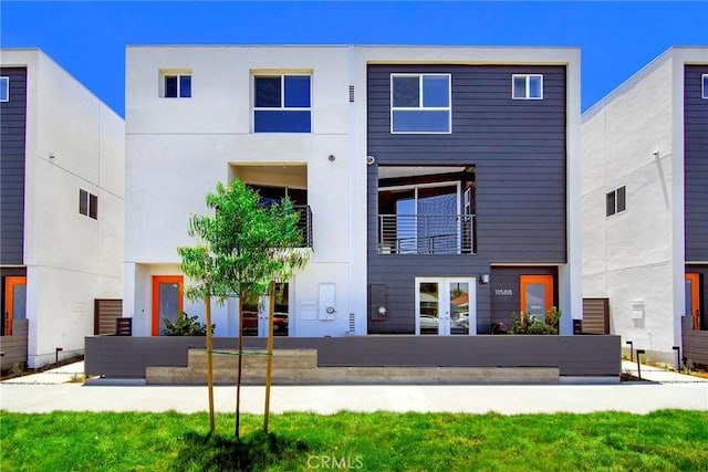 rear view of property featuring french doors