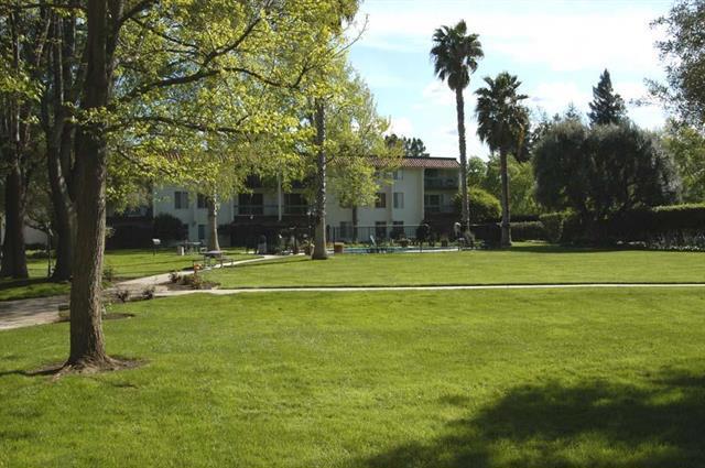 view of home's community featuring a lawn