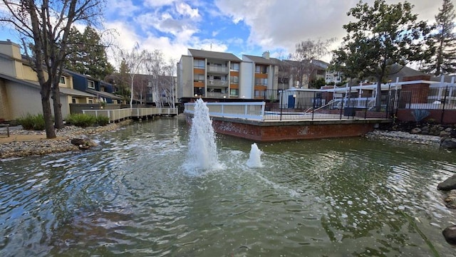 view of home's community with a water view