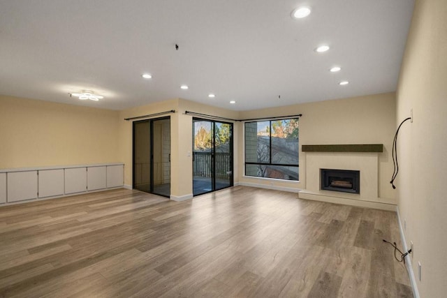 unfurnished living room featuring light wood-type flooring