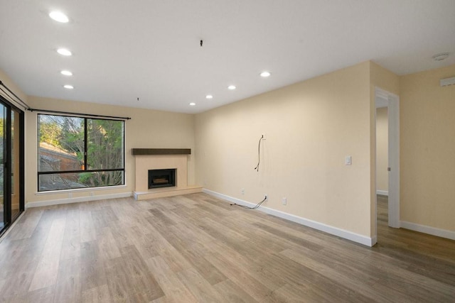 unfurnished living room featuring light hardwood / wood-style flooring