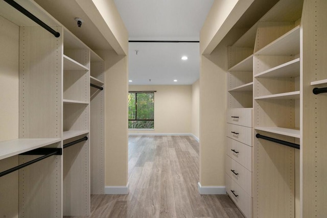 walk in closet featuring light hardwood / wood-style floors