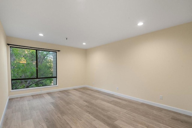 unfurnished room featuring light wood-type flooring