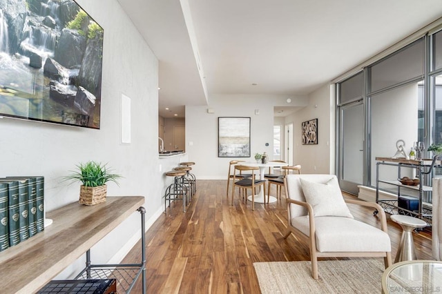 sitting room featuring light hardwood / wood-style floors