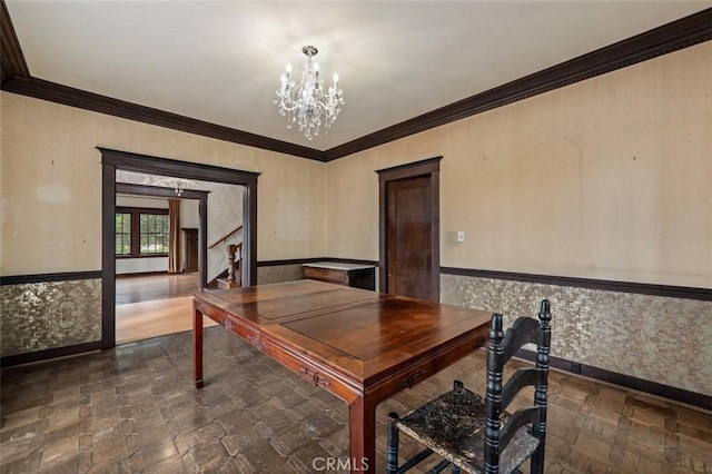 office area with crown molding and a chandelier