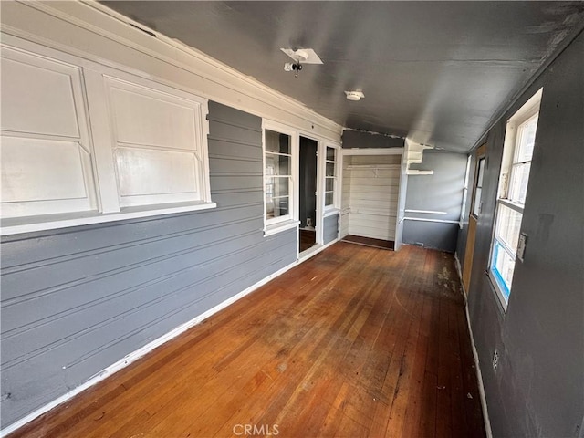 unfurnished sunroom featuring lofted ceiling