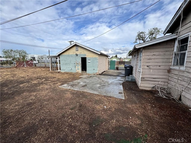 view of outbuilding with fence