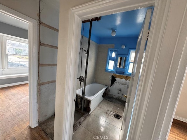 bathroom featuring a bathing tub and hardwood / wood-style floors