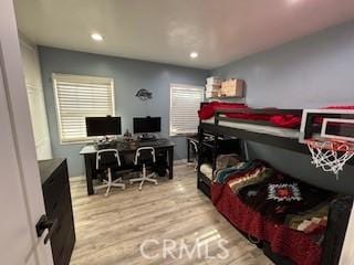 bedroom with light hardwood / wood-style floors