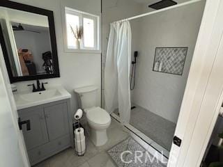 bathroom featuring vanity, tile patterned flooring, toilet, and a shower with shower curtain