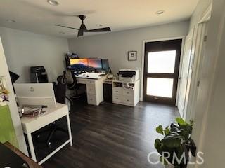 office featuring dark hardwood / wood-style floors and ceiling fan