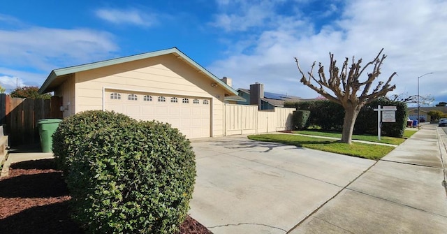 view of side of property with a garage