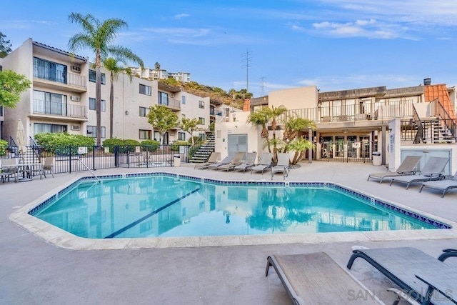 view of pool featuring a patio