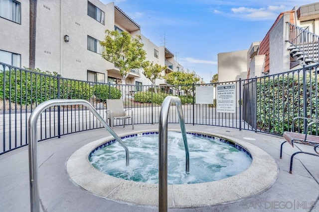 view of pool featuring a hot tub