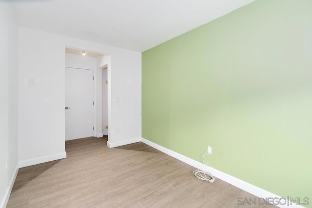 unfurnished room featuring light hardwood / wood-style flooring