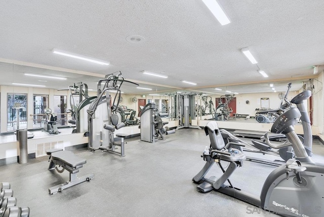 gym with a textured ceiling