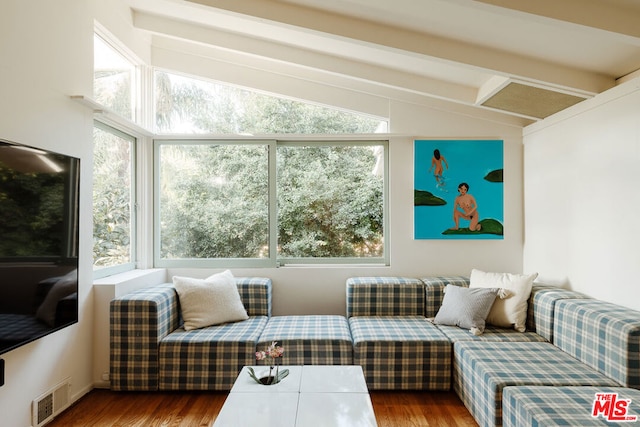 interior space with lofted ceiling with beams