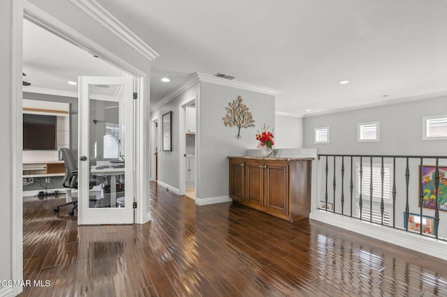 hallway featuring crown molding and dark wood-type flooring