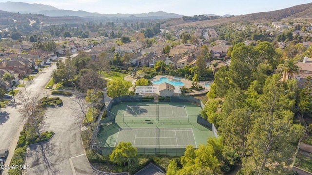 birds eye view of property with a mountain view