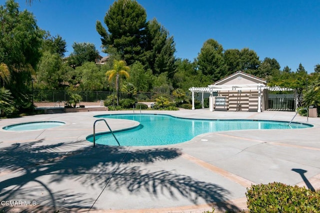 view of pool with a pergola, a hot tub, and a patio