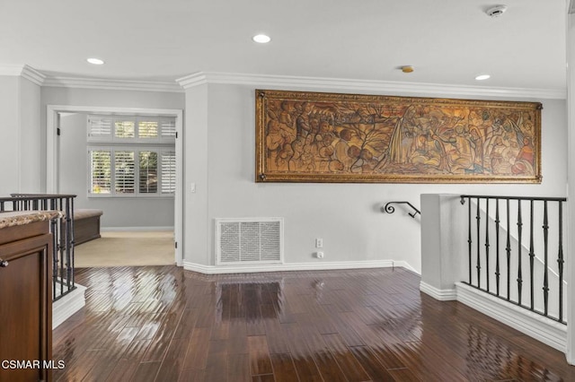 laundry area with crown molding and wood-type flooring