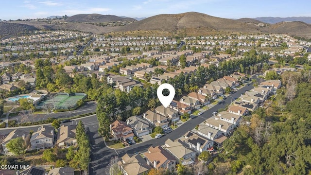 birds eye view of property with a mountain view