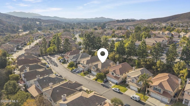 drone / aerial view featuring a mountain view