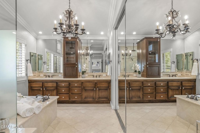 bathroom featuring a bathing tub and a chandelier