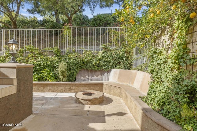 view of patio / terrace featuring a fire pit