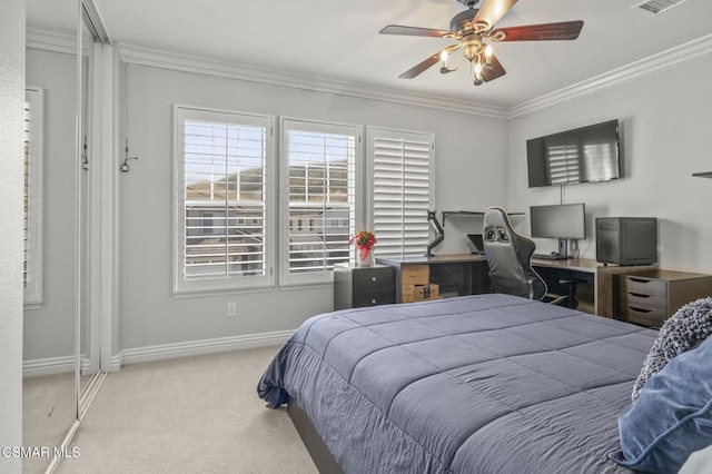 bedroom featuring light colored carpet, ornamental molding, and ceiling fan