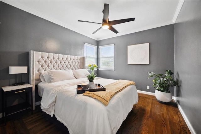 bedroom featuring crown molding, dark hardwood / wood-style floors, and ceiling fan