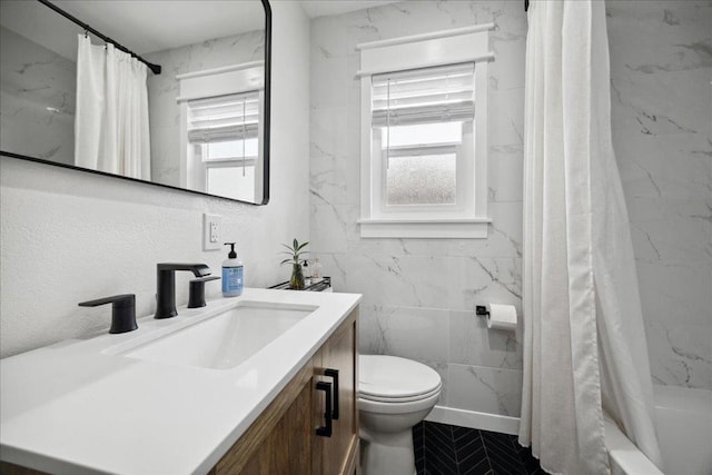 full bathroom with vanity, shower / bathtub combination with curtain, and toilet