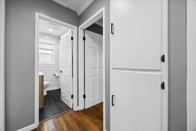 hallway with dark hardwood / wood-style floors