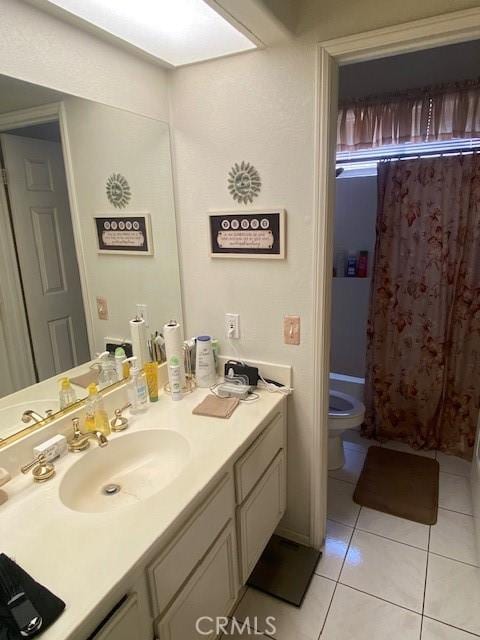 full bathroom with shower / bath combination with curtain, vanity, tile patterned floors, and toilet