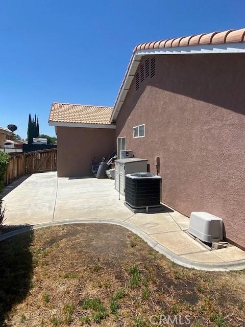 exterior space featuring a patio area and central air condition unit