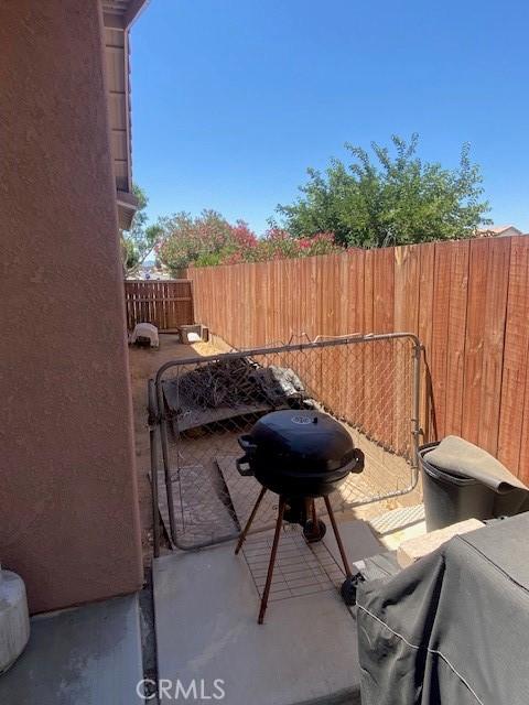 view of patio featuring a grill