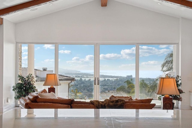 sunroom / solarium with plenty of natural light and lofted ceiling with beams