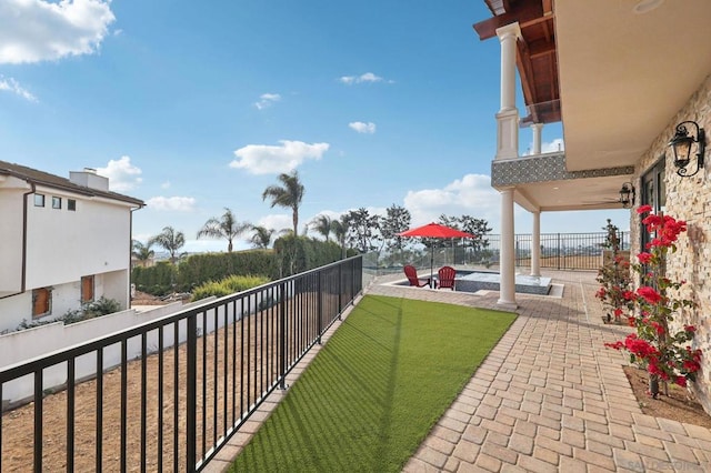 view of yard featuring a balcony