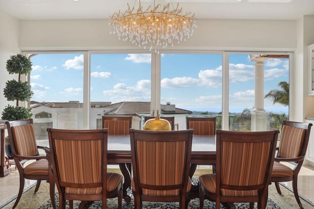 sunroom featuring a notable chandelier and a wealth of natural light