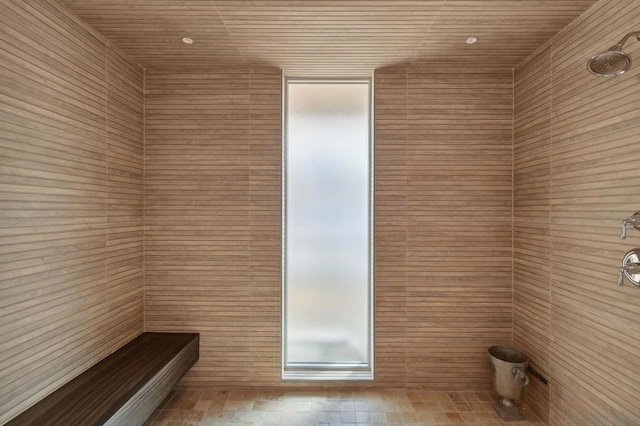 bathroom with tiled shower