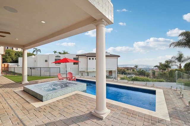 view of swimming pool with a patio area, a hot tub, and ceiling fan