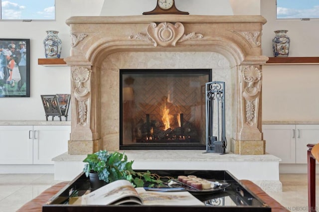 interior details featuring a high end fireplace