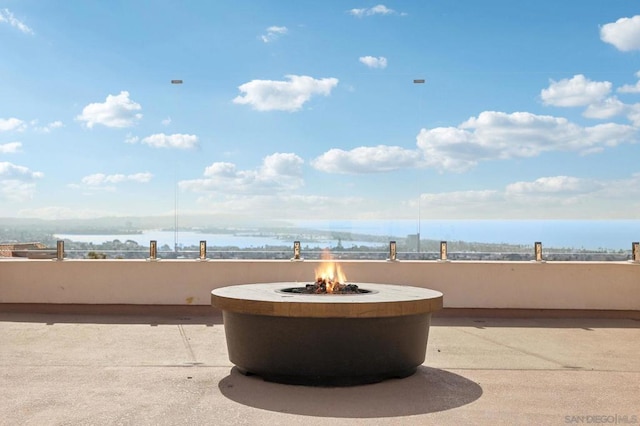 view of patio / terrace featuring an outdoor fire pit