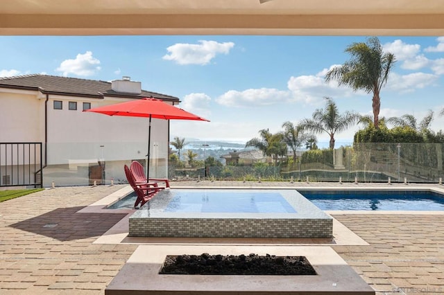 view of swimming pool with a patio