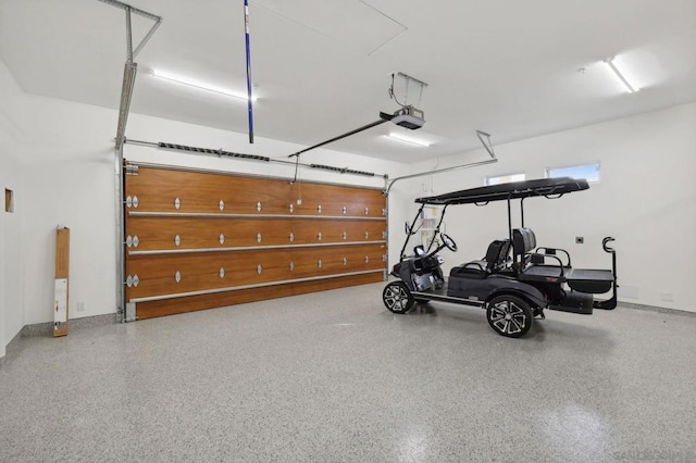 garage featuring a garage door opener